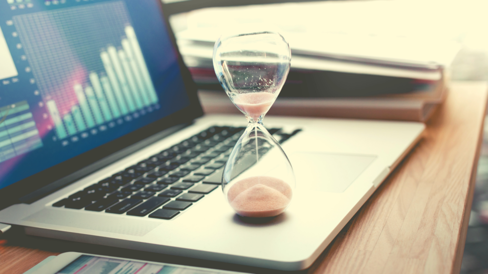 An hour glass on a computer