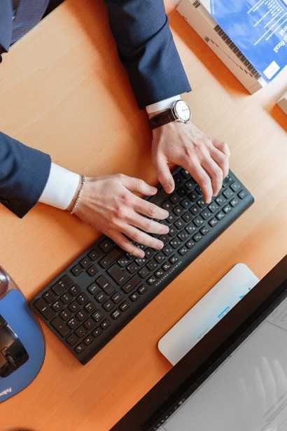 A man typing on a keyboard